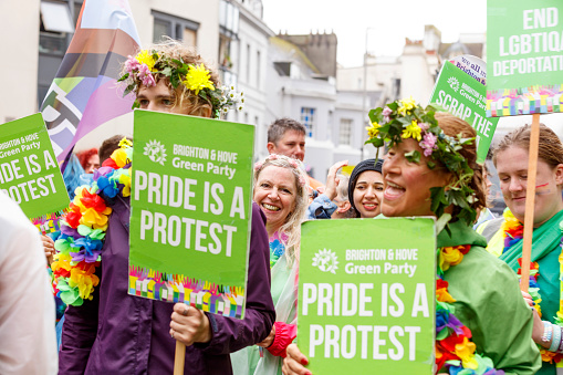 Brighton, England - August 5th 2023: Brighton & Hove Green Party at the pride parade. The Brighton & Hove Pride Parade 2023 begins in wet and rainy conditions on August 05, 2023, in Brighton, England.