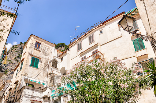 Amalfi Coast, Italy - July 27, 2023: Windows and balconies of buildings along the streets of Amalfi