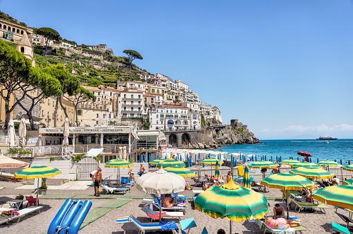 Amalfi Coast, Italy - July 27, 2023: People enjoying the beaches along the shorelines of Amalfi
