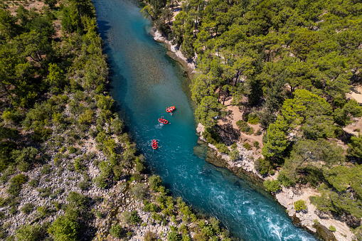 Aerial view of group of inflatable rafting boats floating down the river in Koprulu Canyon, Manavgat, Antalya