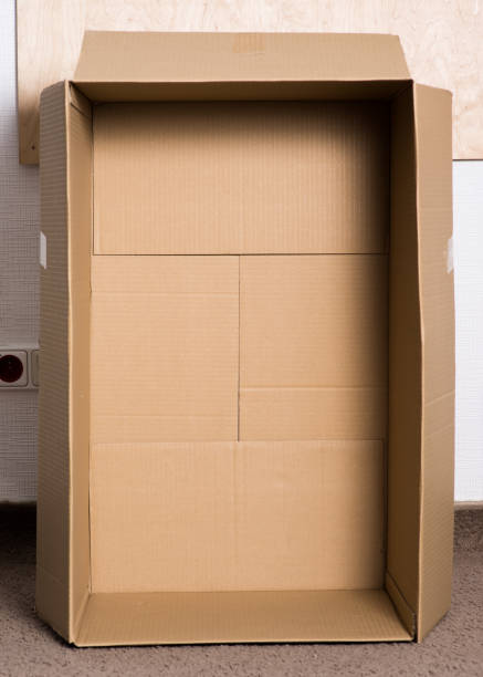 istock Inside view of empty brown cardboard box. Packaging for transportation. Courier shipping, selling or delivery 1596970789