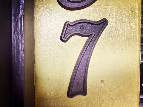 Purple Number 7 on a Door