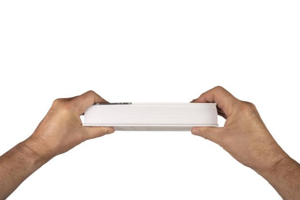 istock A book in the male hands 1596978263
