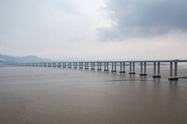 istock Traffic flow on the cross-sea bridge before the rainstorm 1596991429