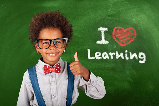 Back To School Concept,African-American Schoolgirl and Ok Sign