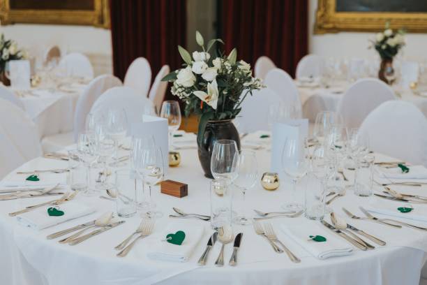 istock white flowers are placed on the tables in this banquet setting 1597029478