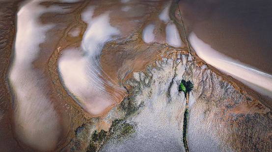 Aerial view of low tide with visible river bed by the beach Llanfairfechan, North Wales, Cymru, UK