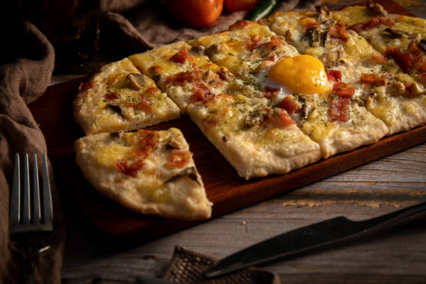 istock pizza on a wooden board 1597126508