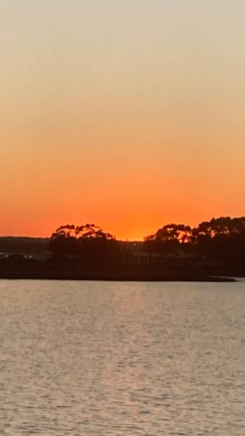 istock Sunset over a natural setting by the sea. Image of relax tranquility and peace 1597153534
