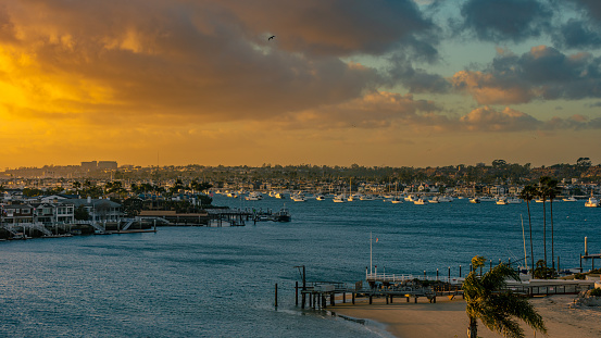 The vibrant hues of the sunset painted the sky above Newport Beach