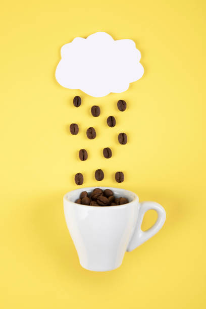 istock Cloud with coffee beans beans and coffee mug 1597195965