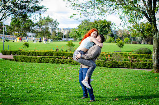 young couple in love in the park together