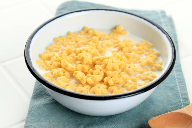Honey Star Flakes with Milk for Breakfast, on White Table