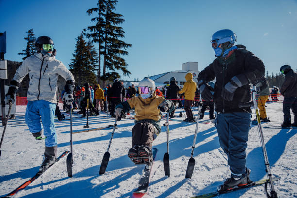 istock Group of adaptive athletes waiting in ski lift queue 1597363002