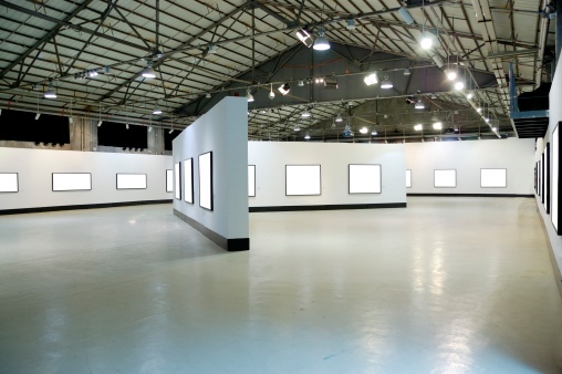 exhibition hall with empty frames on the wall