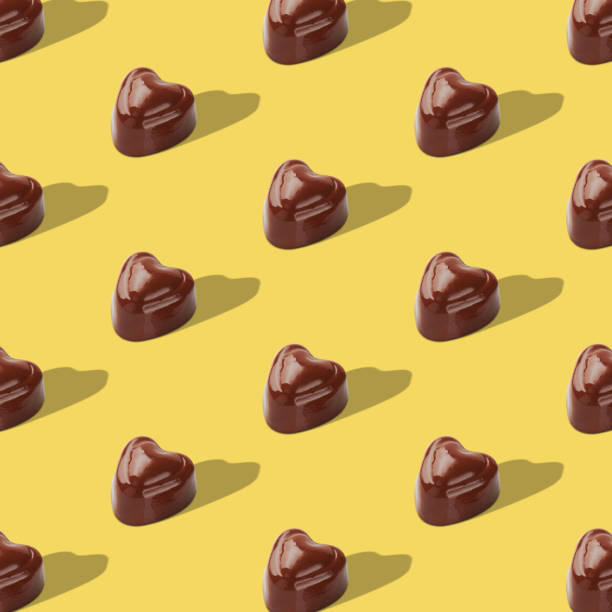 istock Chocolate sweets on yellow background. Top view. Pop art design. 1597401966