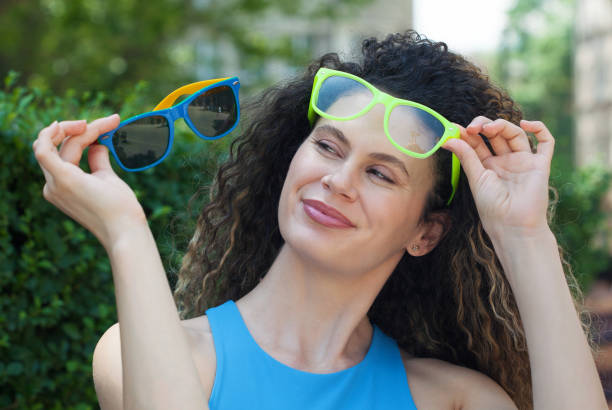 istock Young woman choosing glasses 1597452306
