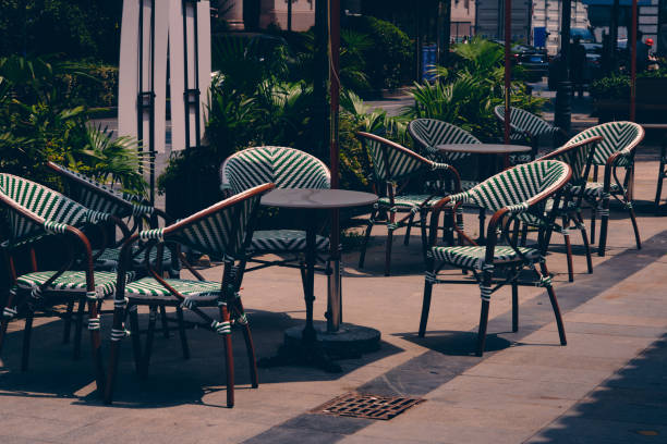 istock Leisure tables and chairs by the street 1597472400