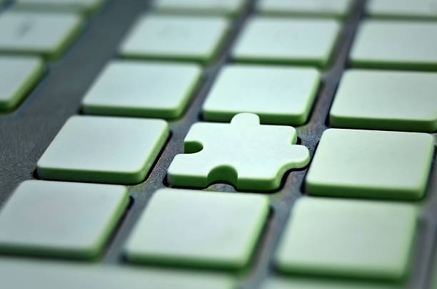 Puzzle key in keyboard stock photo