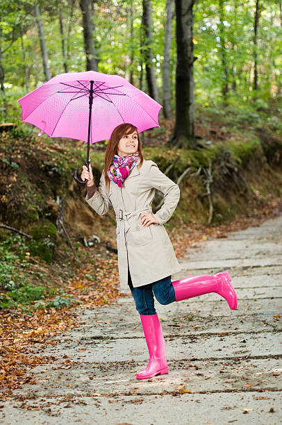 istock Cute young woman having fun after raining 159751131