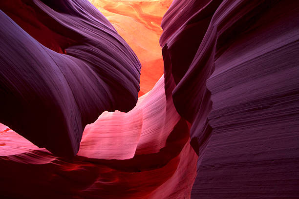 Landscape image of lower Antelope Canyon in stunning colors Incredible bounce light in Lower Antelope Canyon, Arizona. geology stock pictures, royalty-free photos & images