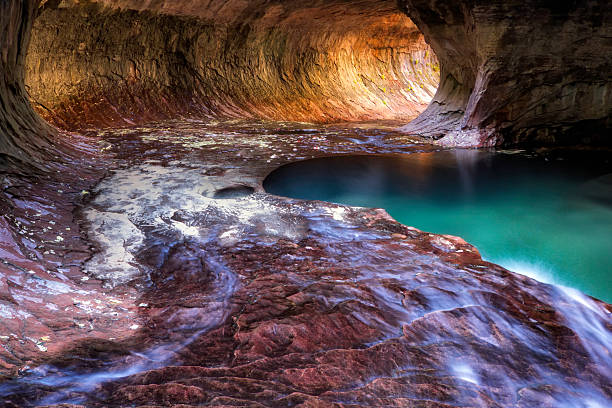 Afternoon light rushes in to the Subway of Zion National Park, Utah.