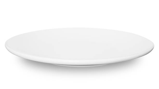 istock White circle ceramics plate isolated on white background. 1597557421