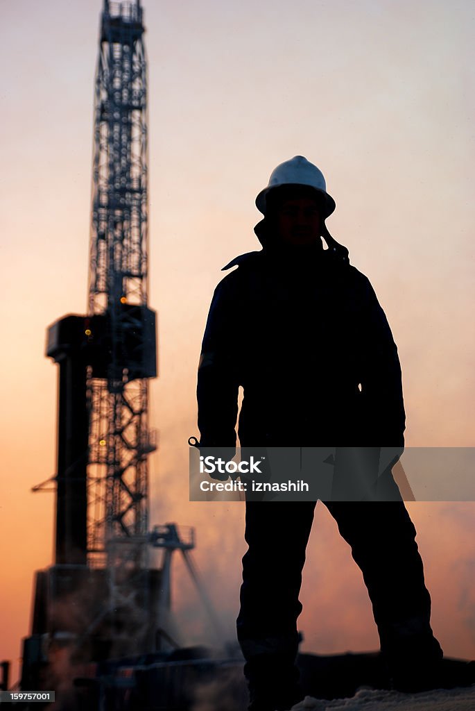 石油男性の夕暮れ - 職業のロイヤリティフリーストックフォト