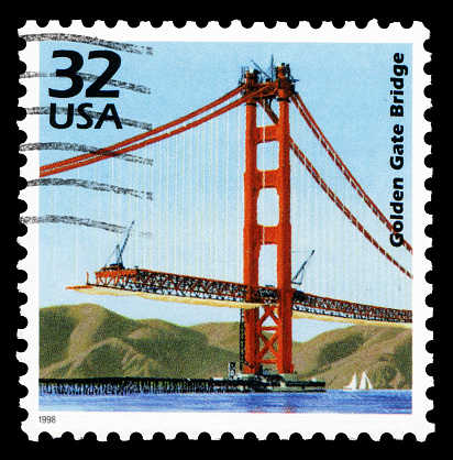 US postage stamp: Golden Gate Bridge under construction(1933-1937) in San Francisco, USA