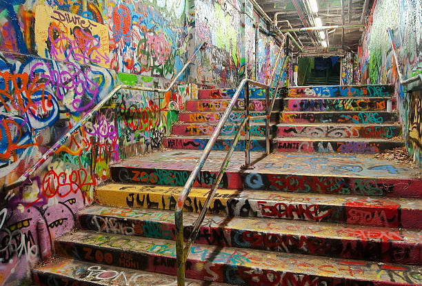 Stairway tunnel filled with Graffiti in University of Sydney The Graffiti Tunnel at the University of Sydney, seen at night. A designated graffiti site for students of the university, colourful designs adorn the floor, surface and ceilings. tunnel photos stock pictures, royalty-free photos & images