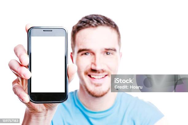 Lächelnder Mann Zeigt Ein Telefon Stockfoto und mehr Bilder von Handy - Handy, Smartphone, Zeigen