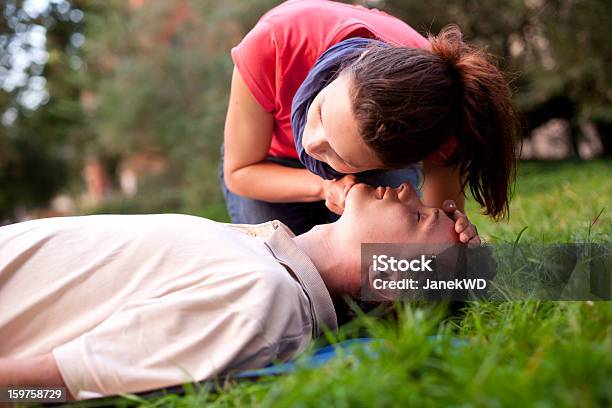 First Aid Look Listen And Feel For Breathing Stock Photo - Download Image Now - CPR, First Aid, Unconscious