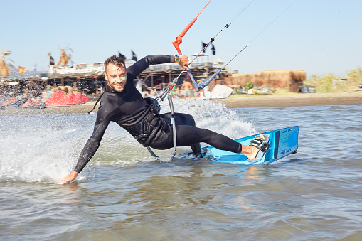 Kiteboarding, Kitesurfing. Water Sports. Professional Kite Surfer In Action On Waves In Ocean. Extreme Sport. Healthy Active Lifestyle. Hobby. Recreational Sporting Activity. Summer Fun, Adventure