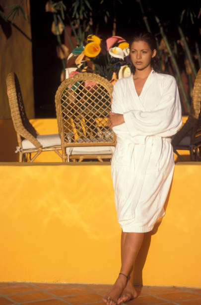 istock Woman wearing a bathrobe outdoors in a resort 1597641648