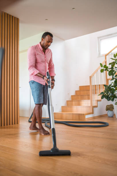 istock Mature Hispanic Father Cleaning His House 1597670863