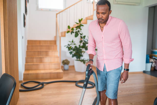 istock Loving Husband Cleaning At Home 1597670885