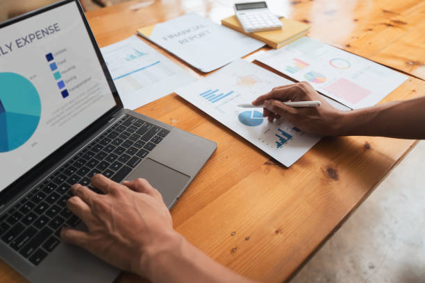 istock Young business man looking at computer monitor, analyzing project statistics, marketing research results or statistics data, developing marketing strategy, working at office 1597671155