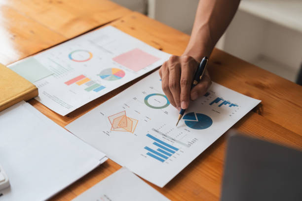 istock Young business man looking at computer monitor, analyzing project statistics, marketing research results or statistics data, developing marketing strategy, working at office 1597671486