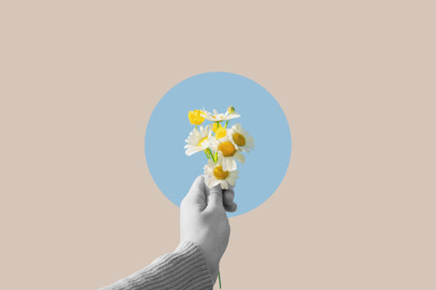 istock Digital collage modern art. Hand holding flowers in circle 1597683061