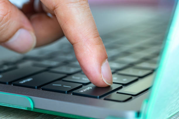 istock Finger of the computer user, he presses the delete button on the computer keyboard. 1597690639
