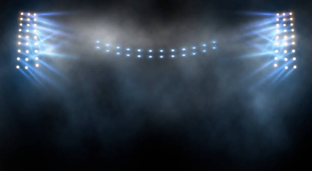 istock Bright stadium arena lights and smoke 1597754670