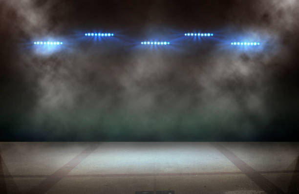 istock Bright stadium arena lights and smoke 1597755196