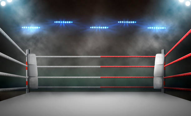 istock boxing ring with illumination by spotlights. 1597755198