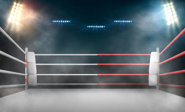 スポットライトによる照明付きのボクシングリング。 - boxing ring combative sport fighting conflict ストックフォトと画像