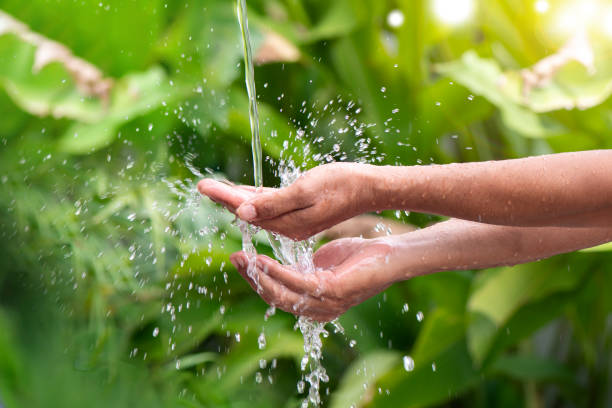 istock Water pouring on hand 1597755223