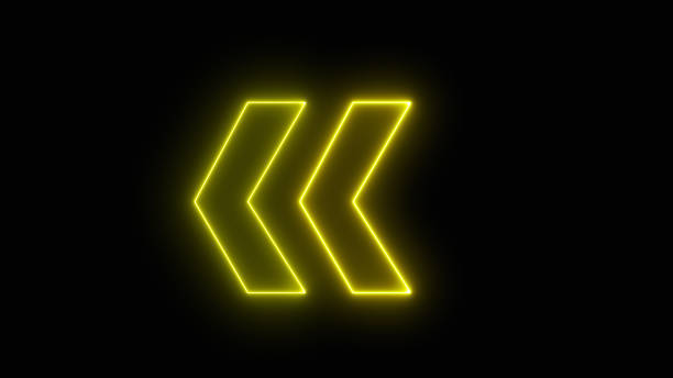 istock Bright yellow arrow for evacuation direction illuminated indoors. neon left direction in the night. Flashing direction indicators. 1597758357