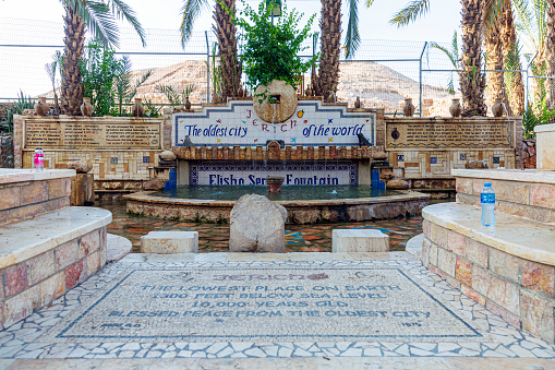 The Elisha Spring Fountain is a natural water source located in the city of Jericho in the West Bank. It holds historical and cultural significance, often associated with the prophet Elisha from the Hebrew Bible. According to the biblical narrative, the prophet Elisha miraculously purified the water of this spring, making it suitable for consumption and irrigation.\n\nThe spring itself is known for its steady flow of fresh water, which has contributed to the agricultural viability of the surrounding area for centuries. The Elisha Spring Fountain has served as a vital water source for Jericho and its inhabitants, playing a crucial role in sustaining both human settlements and cultivation of crops in an otherwise arid region.\n\nThe site holds religious and cultural importance for various communities, including Jews, Christians, and Muslims, due to its connection with the biblical story and its significance in historical and traditional contexts. It serves as a reminder of the interplay between human settlement, natural resources, and religious narratives in shaping the region's history.