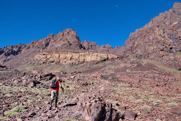 istock Senior man hiking in mountains 1597808936