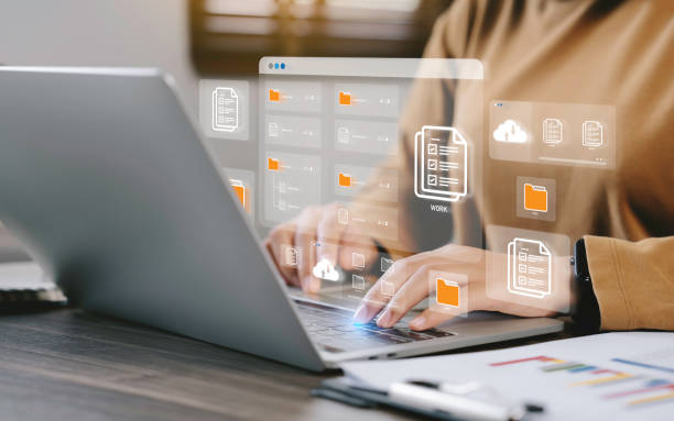 Businessman using a computer to document management concept, online documentation database and digital file storage system or software, records keeping, database technology, file access, doc sharing. Businessman using a computer to document management concept, online documentation database and digital file storage system or software, records keeping, database technology, file access, doc sharing. internet theatre database stock pictures, royalty-free photos & images