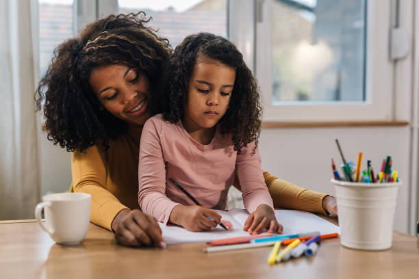 istock mother and daughter at home 1597844198